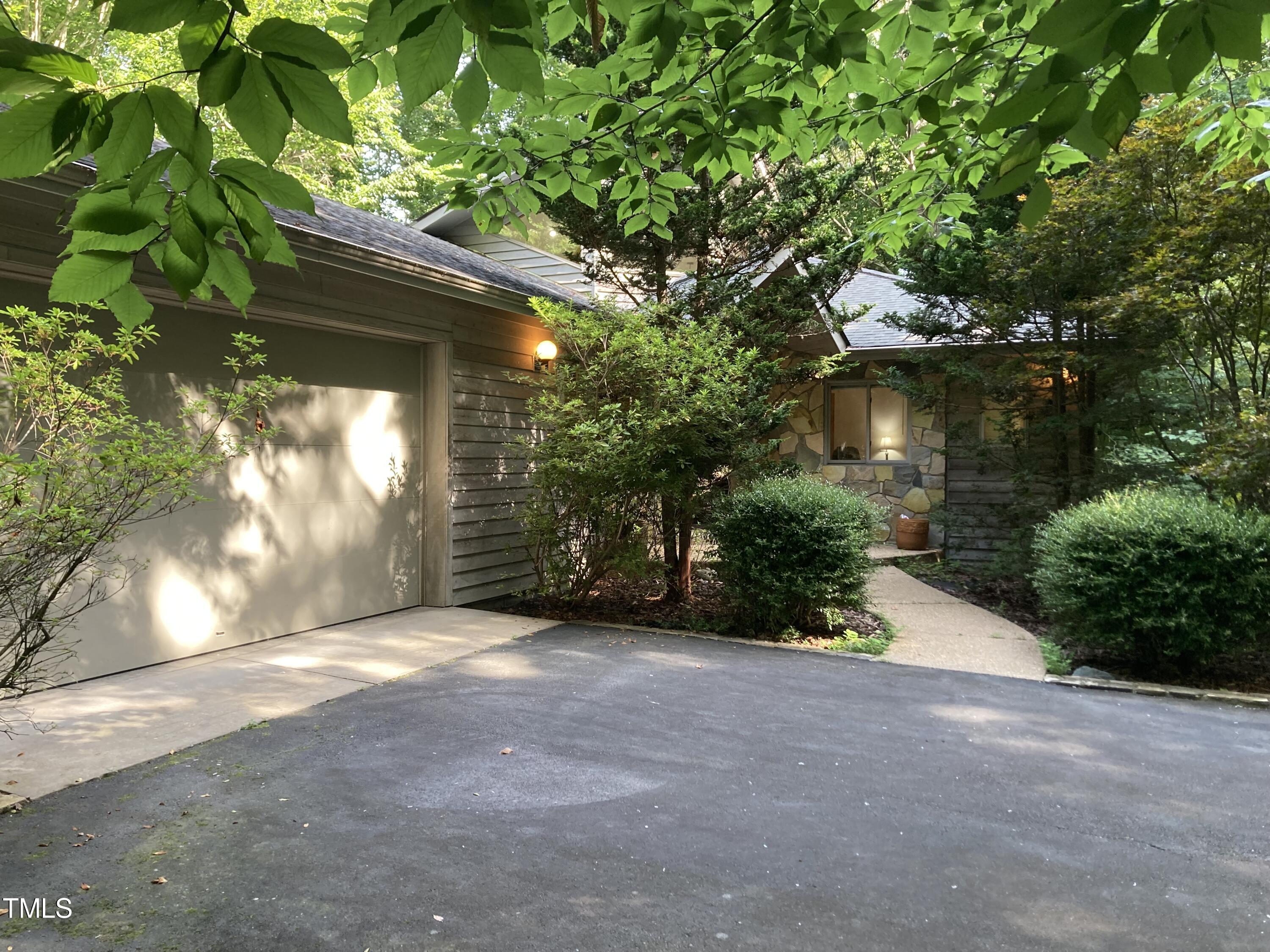 a view of a house with a tree