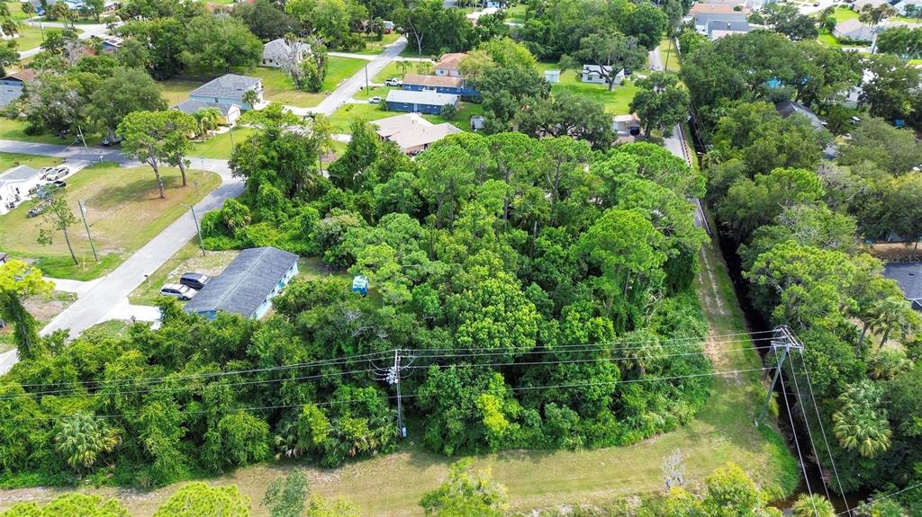 an aerial view of residential house with outdoor space and swimming pool