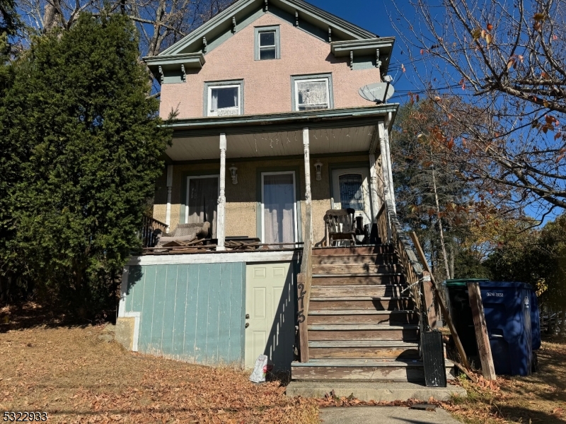 a view of a house with large windows