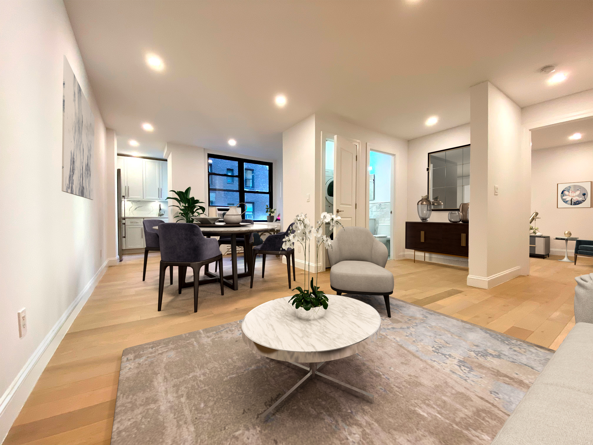 a living room with furniture and kitchen view