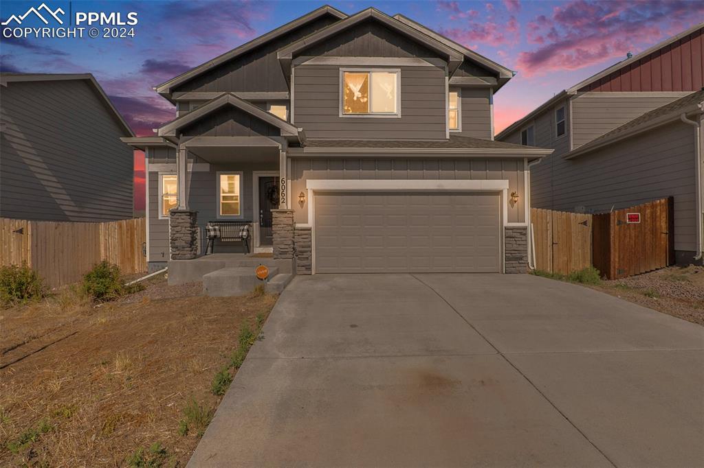 a front view of a house with yard