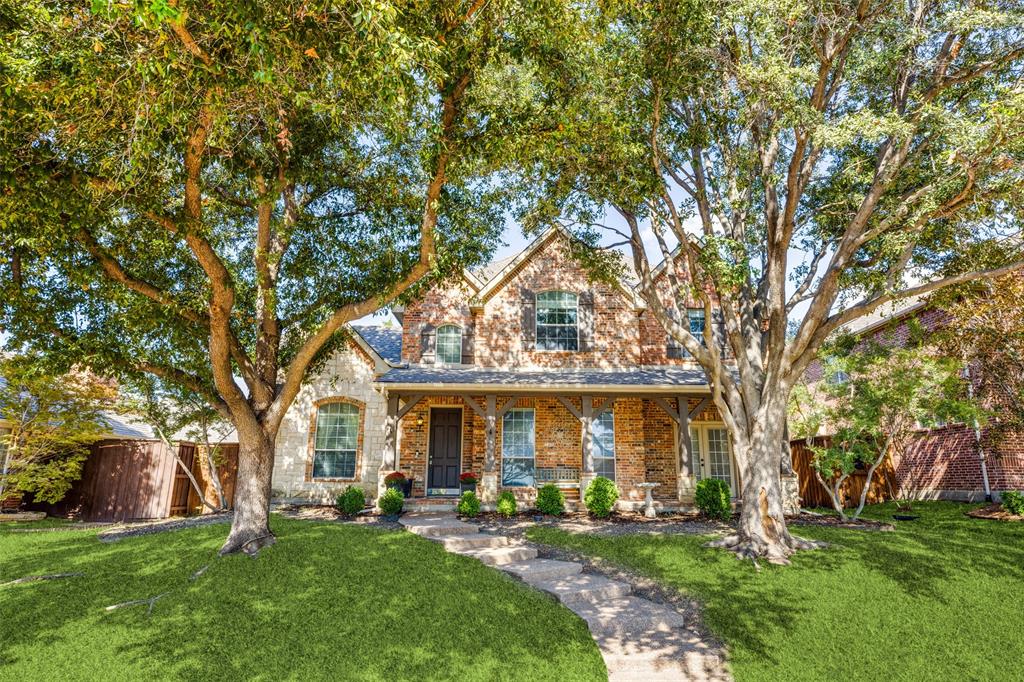 front view of a house with a yard