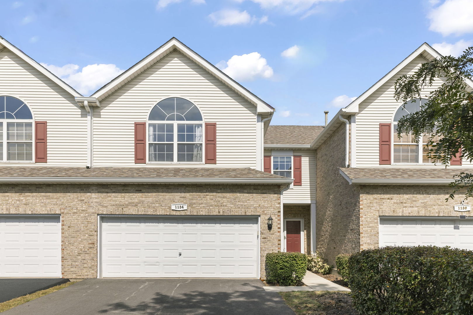 a front view of a house with a garage