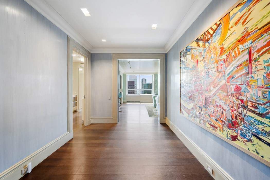 a view of an entryway with wooden floor