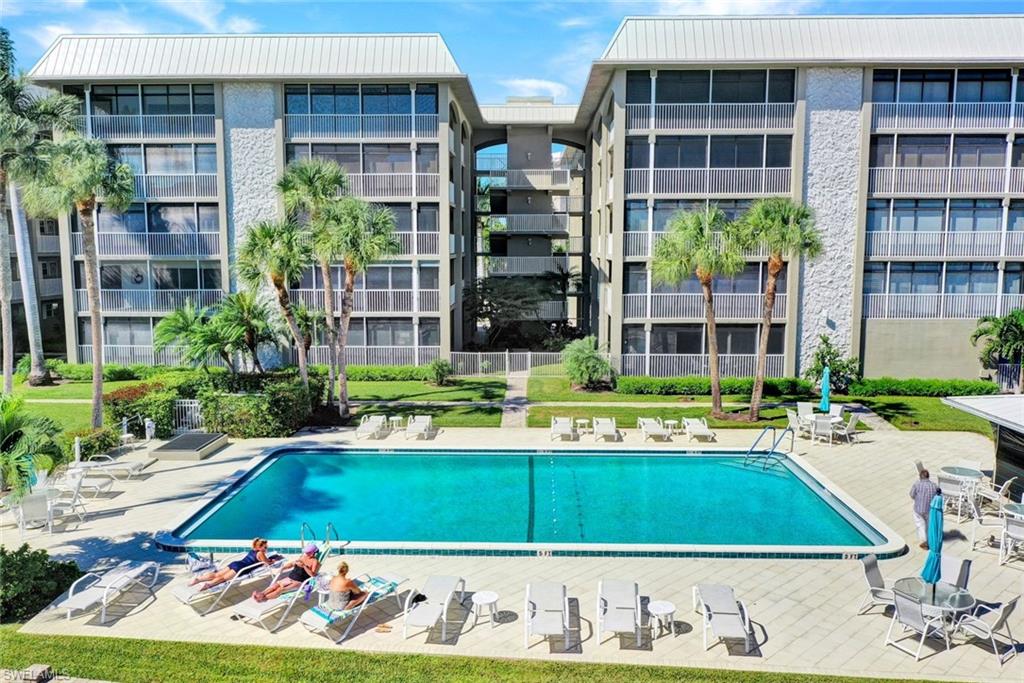 a view of swimming pool with outdoor seating