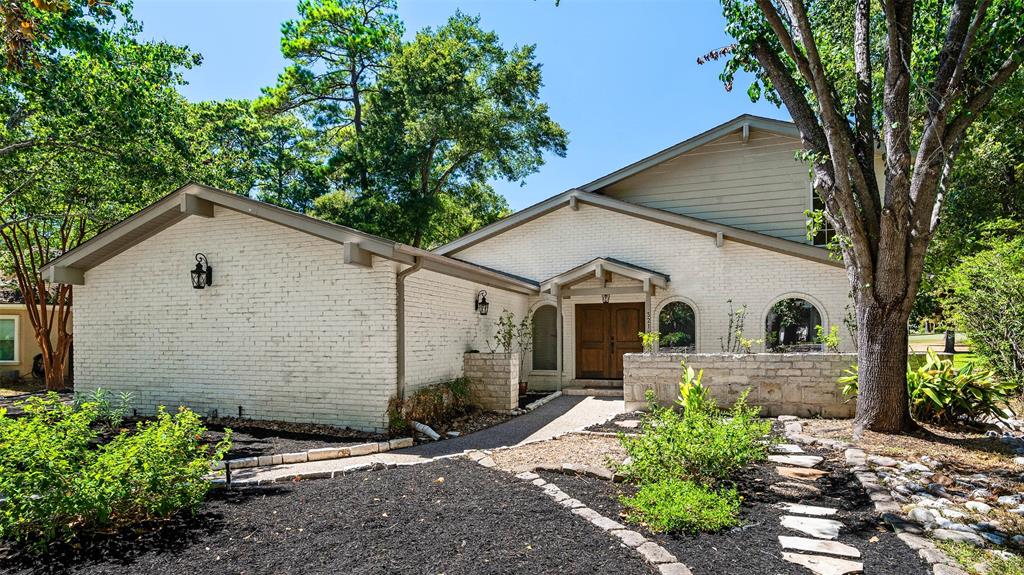 a front view of a house with yard