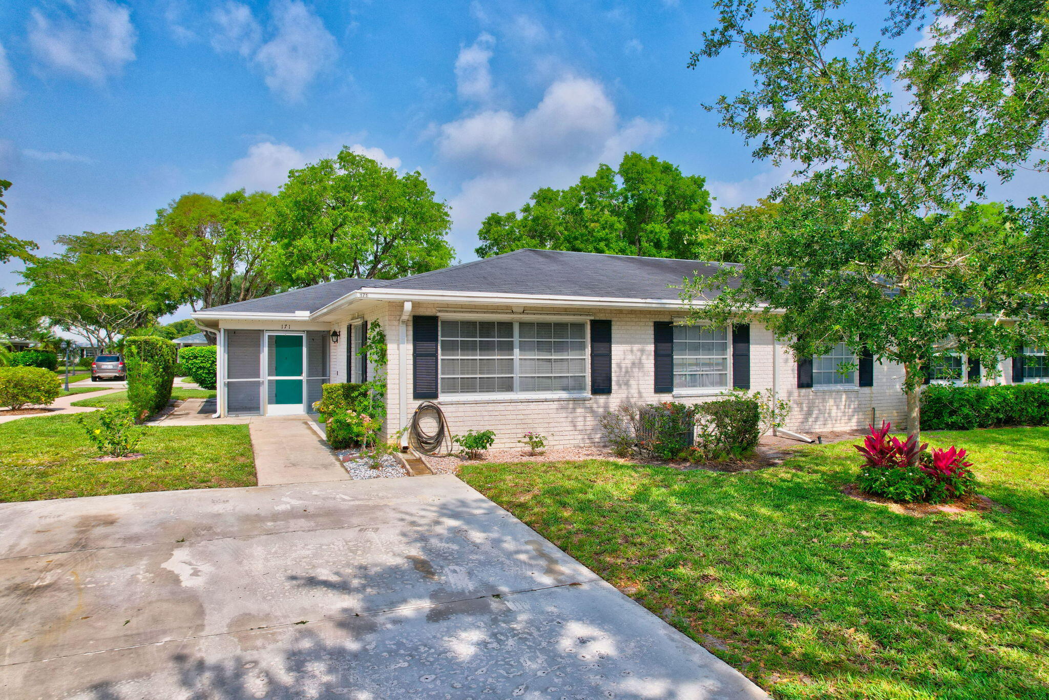 a front view of a house with a yard and porch