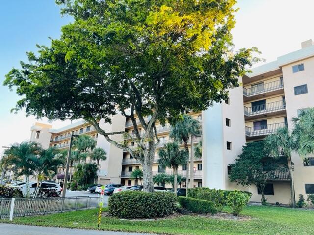 a view of a building with a yard