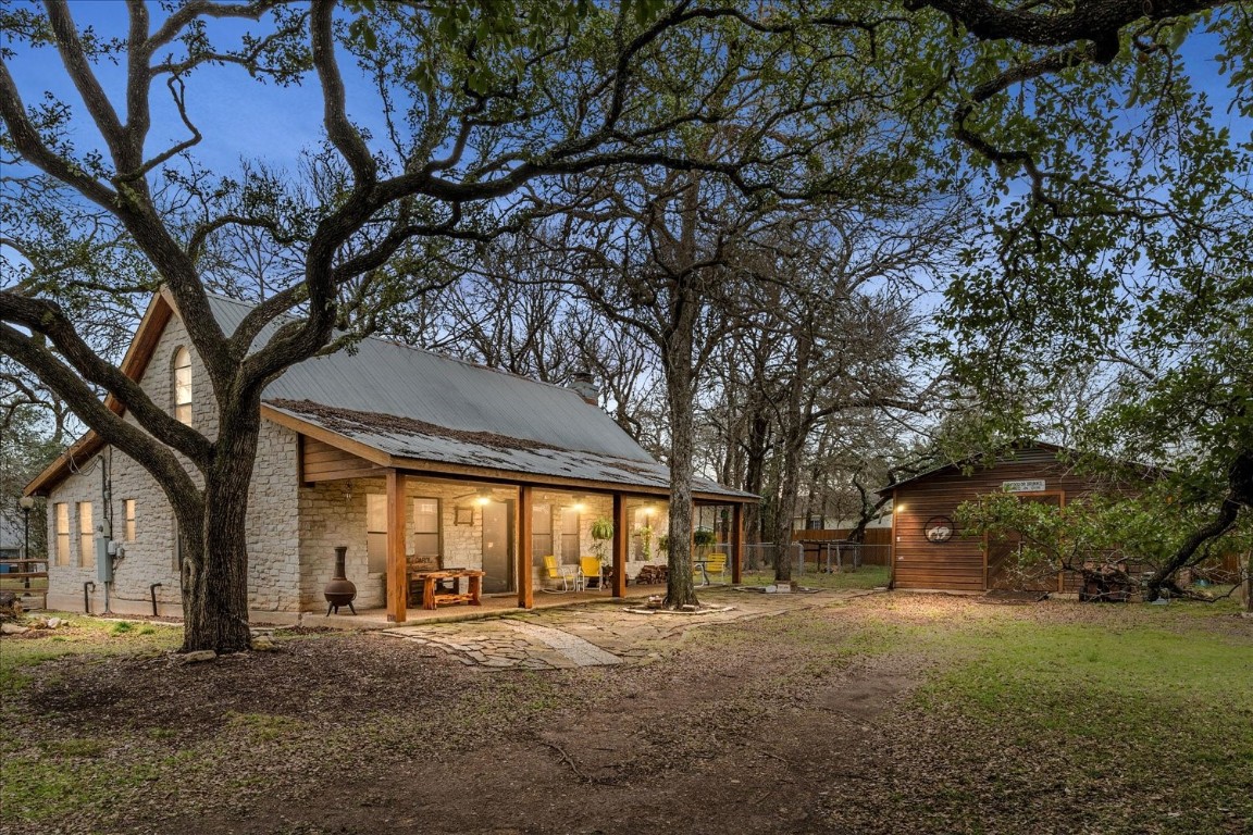 a big yard with large trees