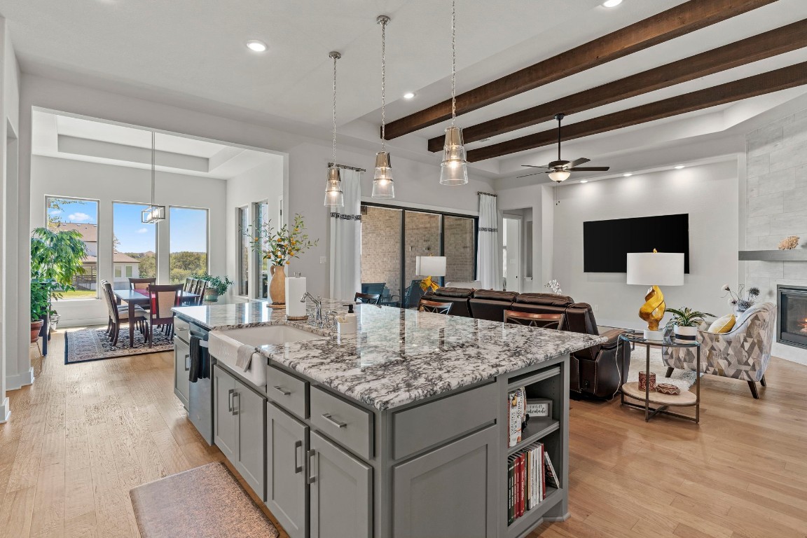 a kitchen with stainless steel appliances granite countertop a stove and a refrigerator