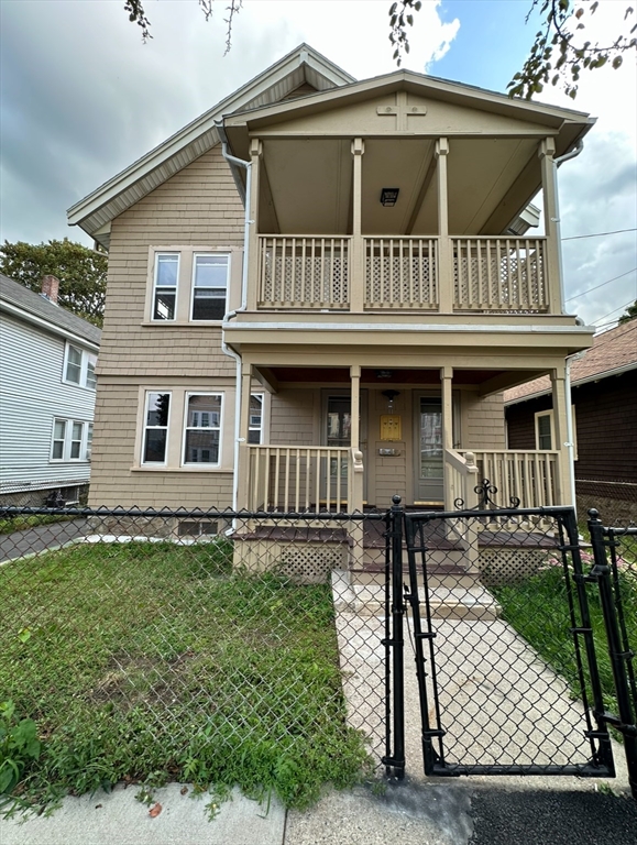 a front view of a house with yard