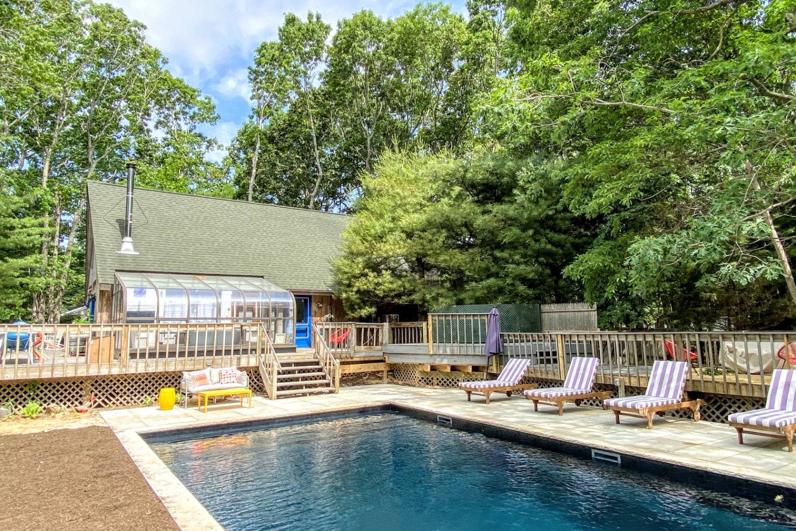 a view of a swimming pool with chairs