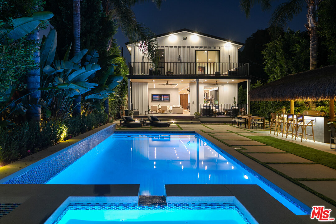 a view of a swimming pool with seating area