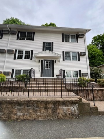 a front view of a house with a balcony