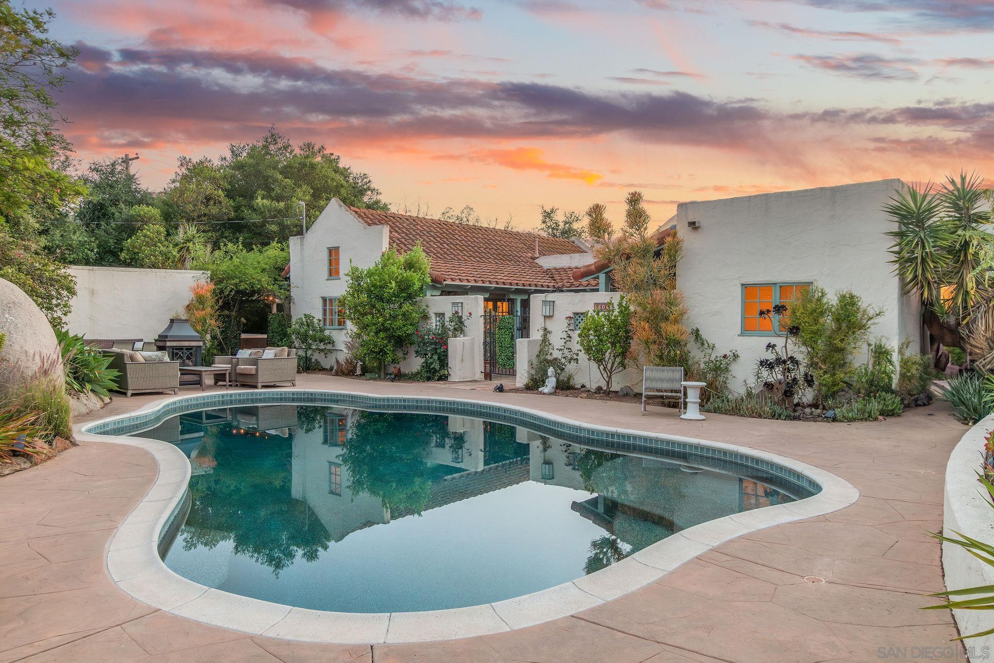 a view of a swimming pool with a yard