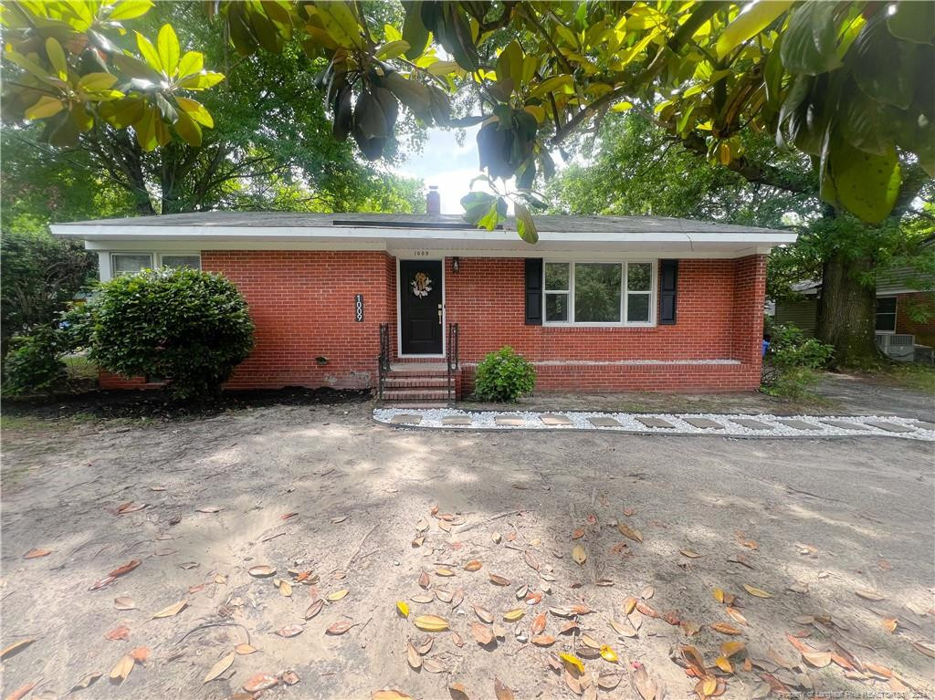 front view of a house with a garden