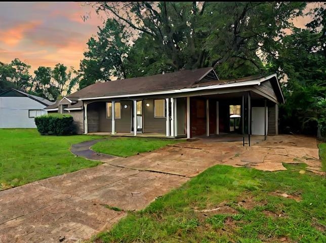 front view of a house with a yard