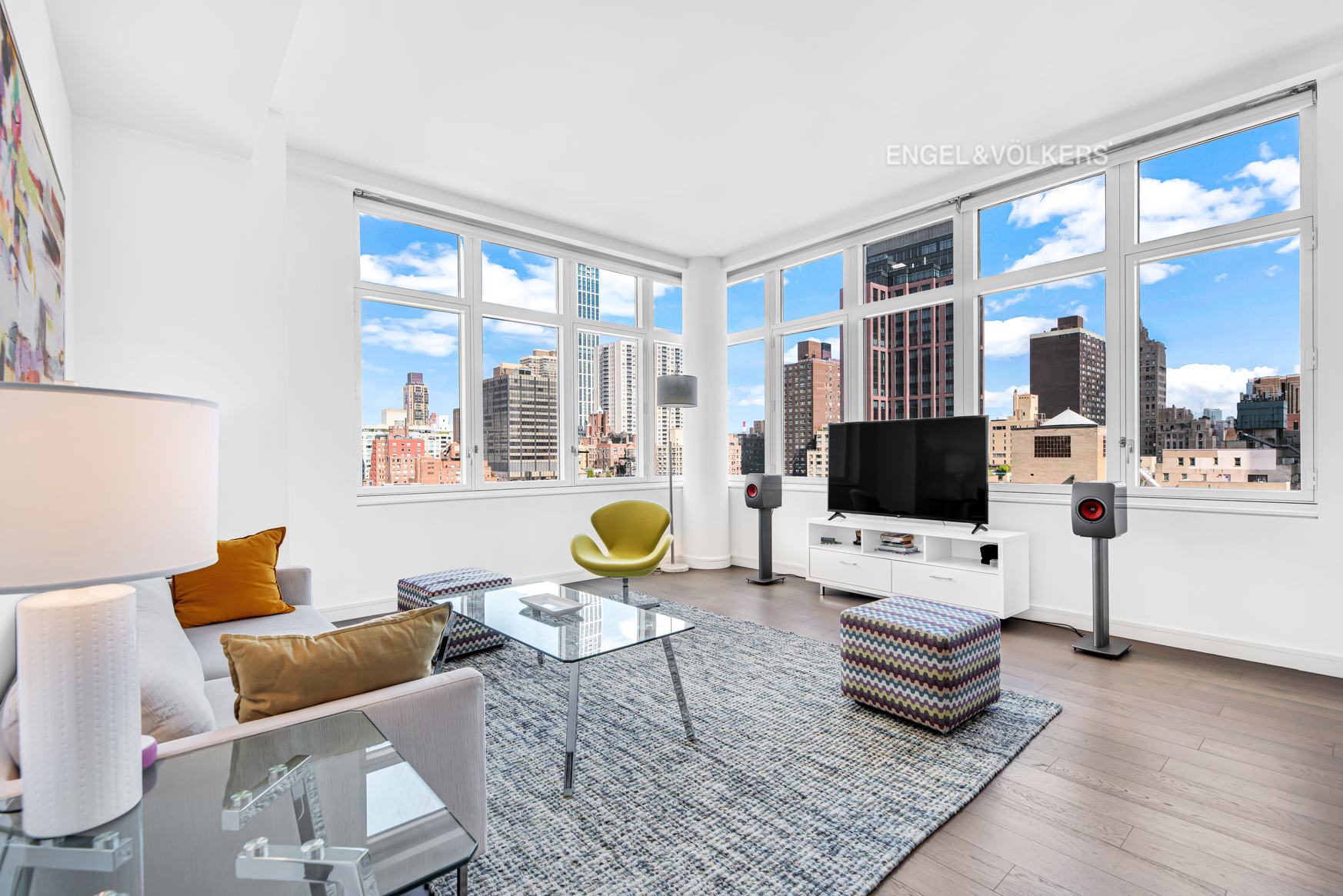 a living room with furniture and a flat screen tv