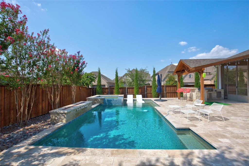 a view of a swimming pool with a patio