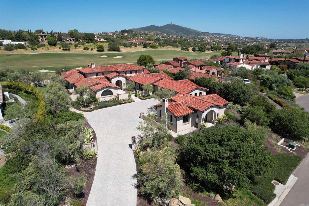 an aerial view of residential houses with outdoor space and river