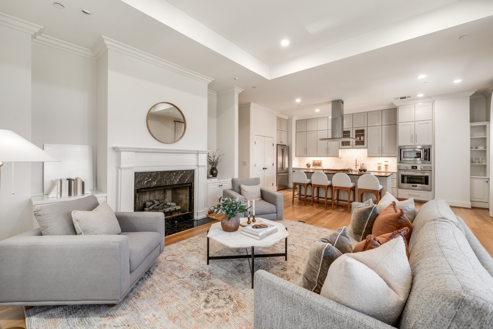 a living room with furniture and a fireplace