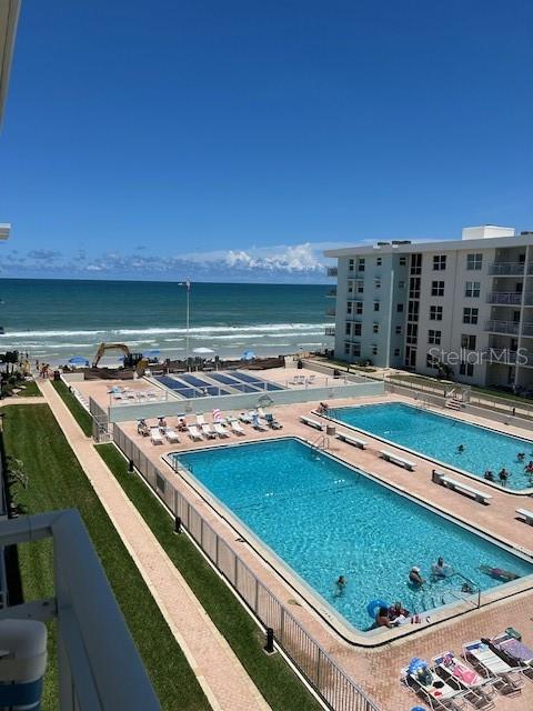 a view of swimming pool from a balcony