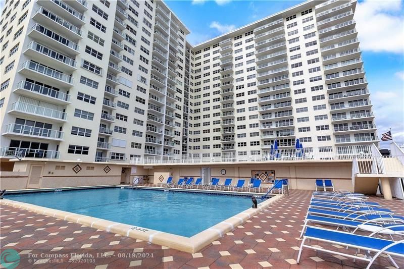 a view of a swimming pool and an outdoor space