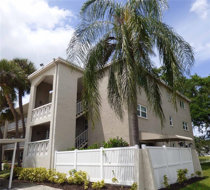 a view of a house with a palm tree