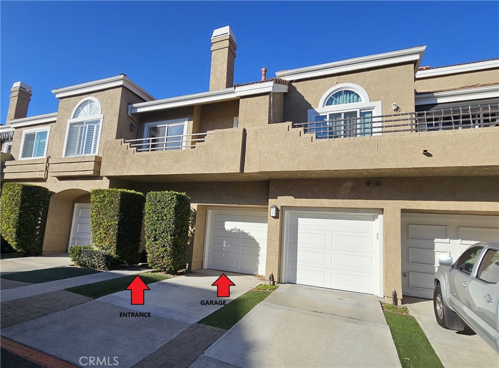 a front view of a house with a garage