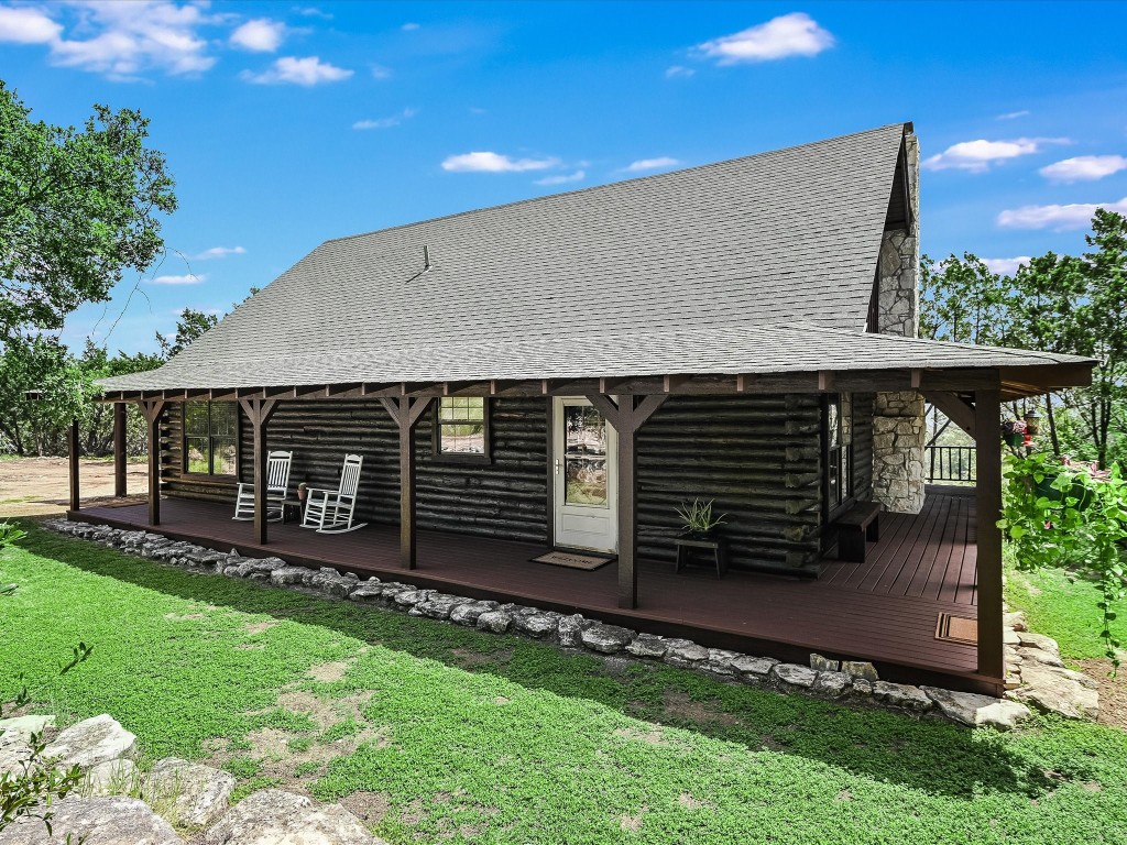 a view of house with backyard