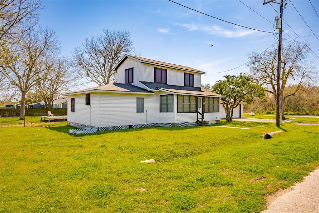 a house view with swimming pool in front of it