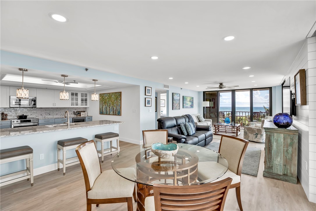 a dining room with furniture and wooden floor