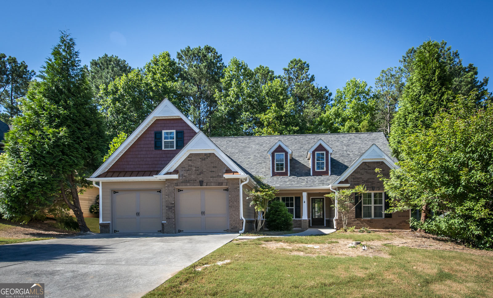 a front view of a house with a yard