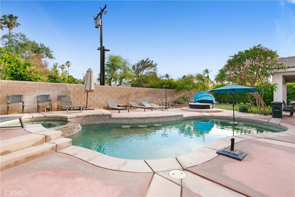 a view of a swimming pool with a patio