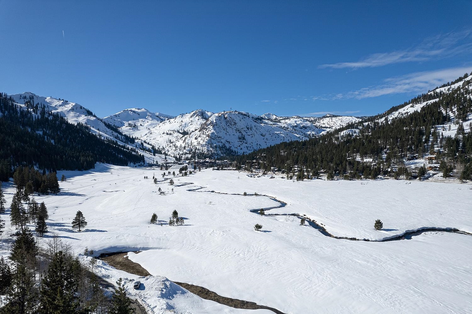 a view of lot of sand and mountain