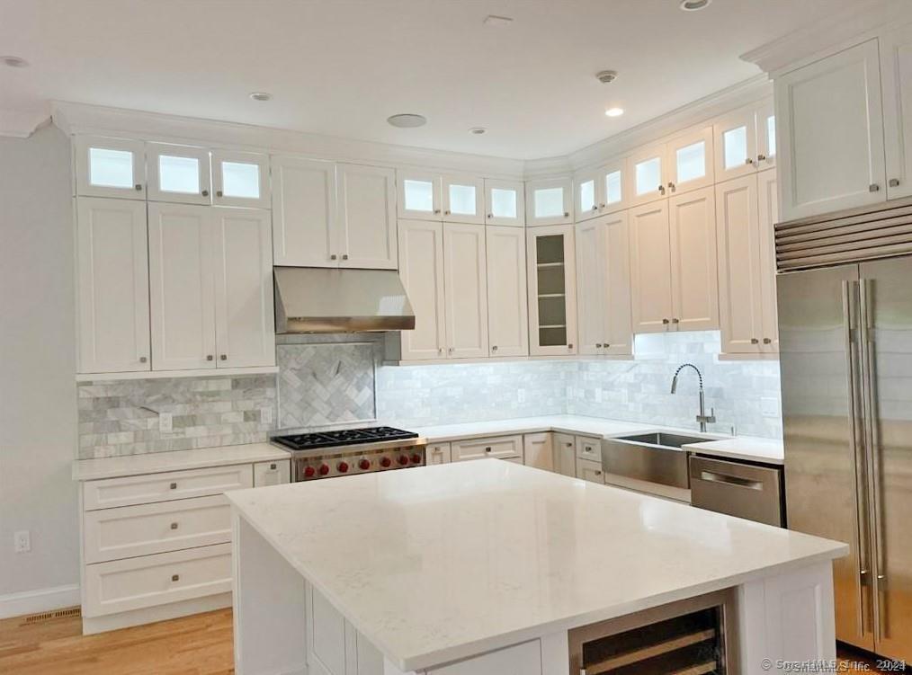 Gourmet Kitchen with custom cabinets and huge island and special lighting.