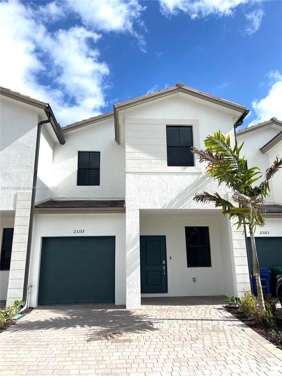 a view of a house with a garage