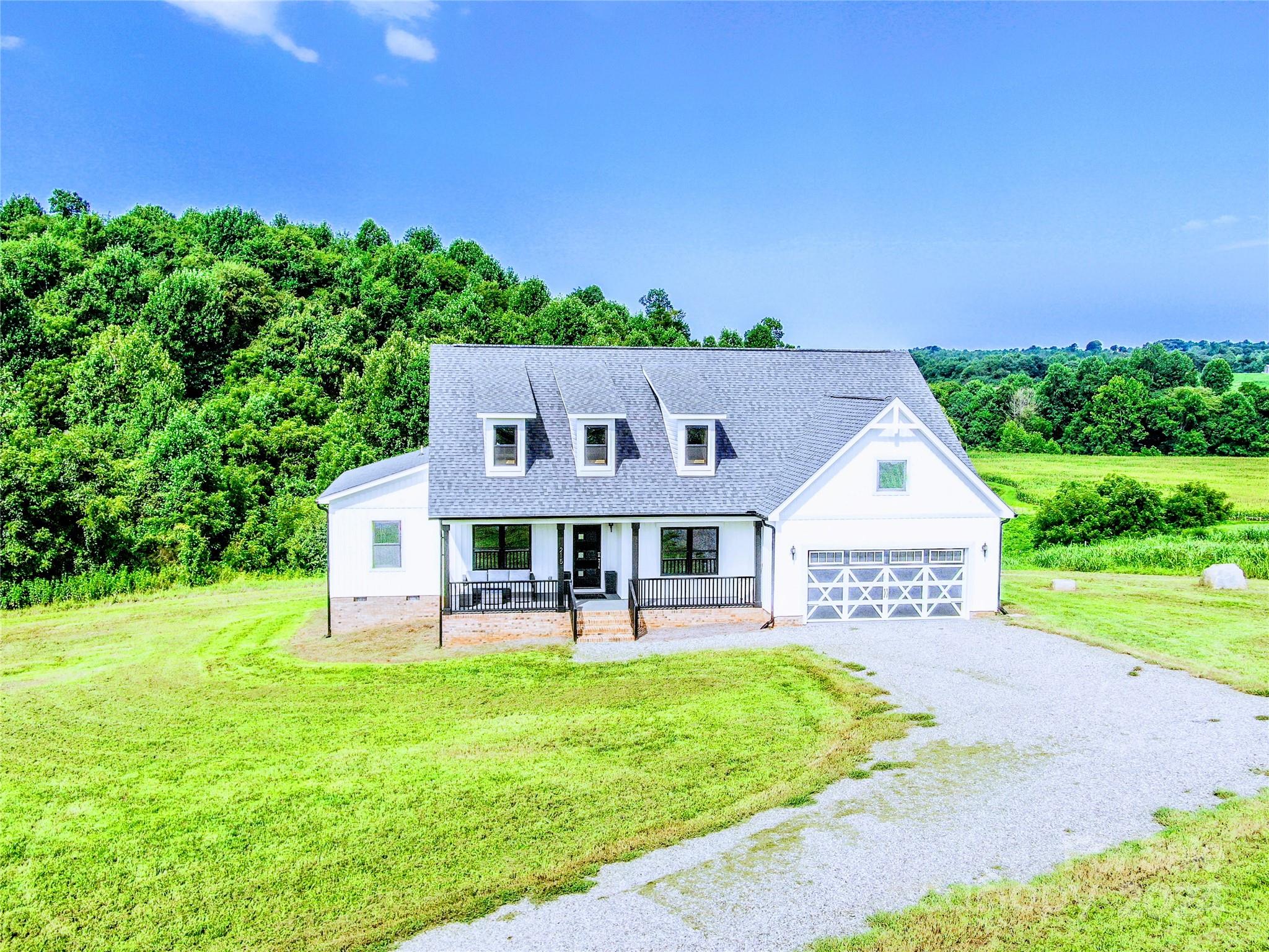 a view of a house with a yard porch and sitting area