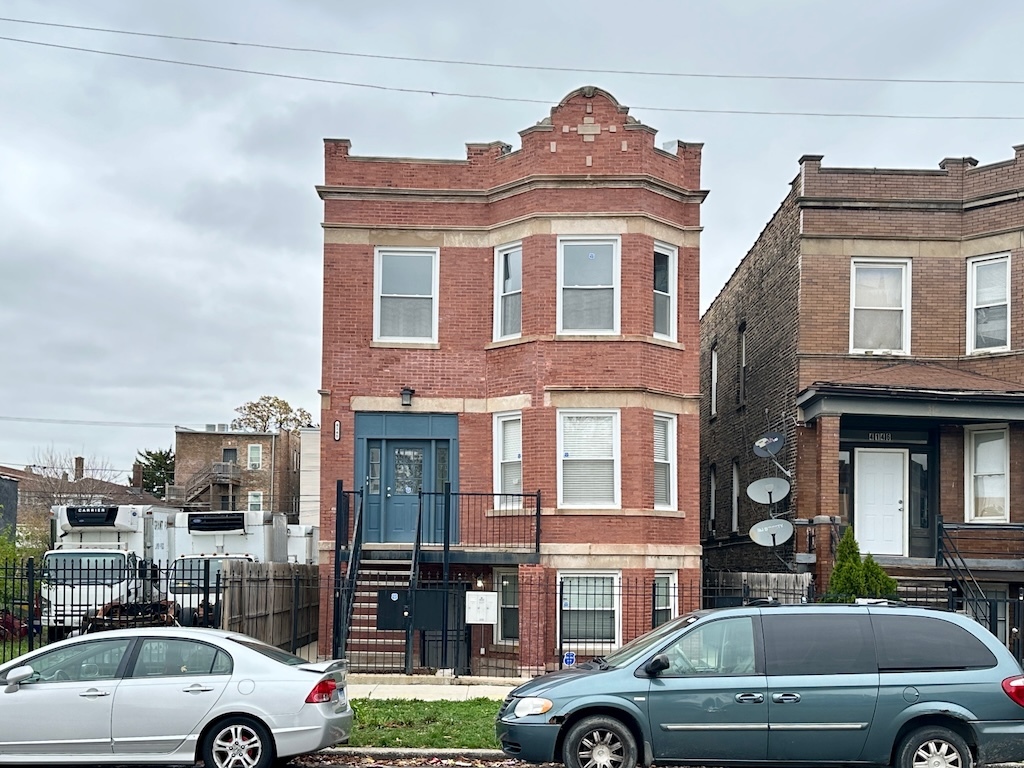 a view of a car parked in front of a building