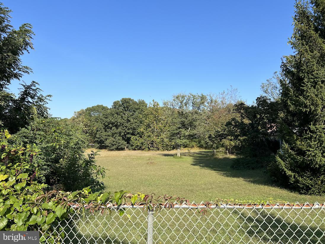 a view of a lake with a yard