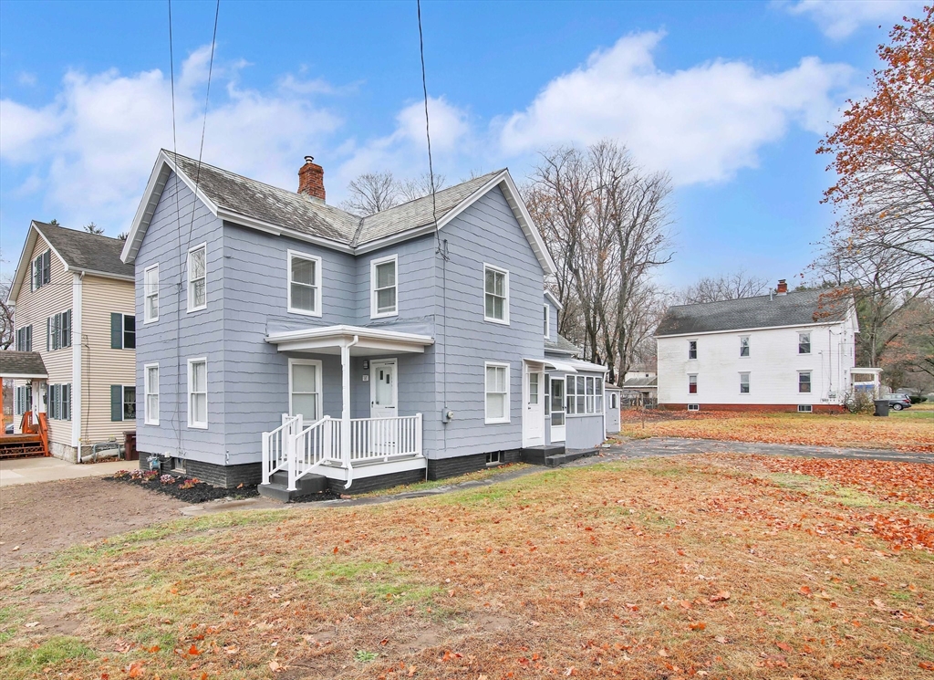 a front view of a house with a yard