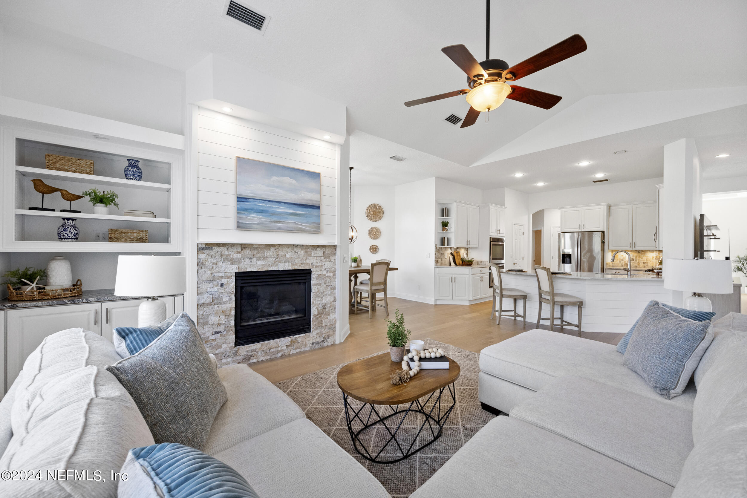 a living room with furniture and a fireplace