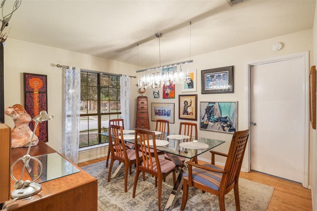 a view of a dining room with furniture kitchen and chandelier