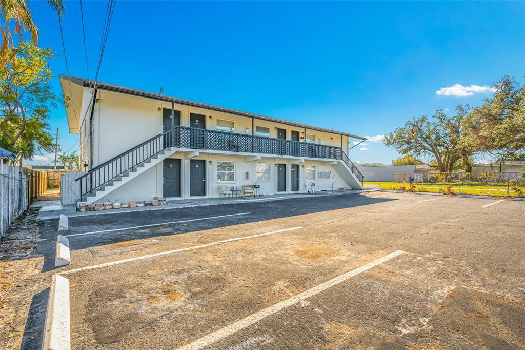 a view of house with outdoor space and swimming pool