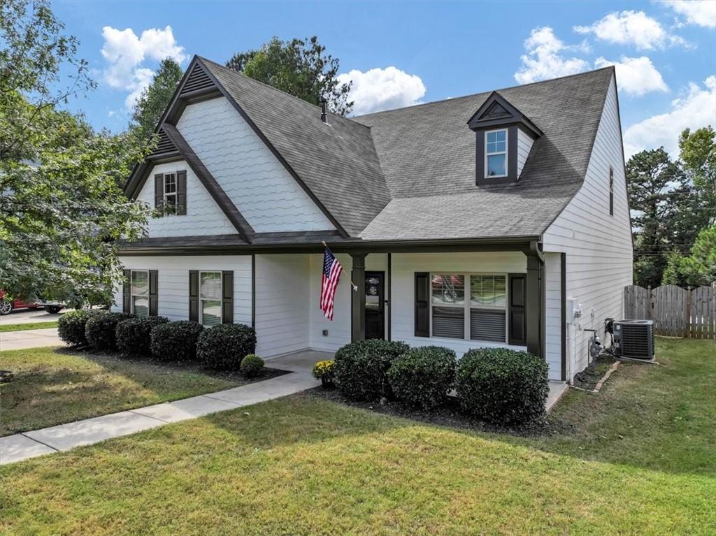 a front view of a house with a yard