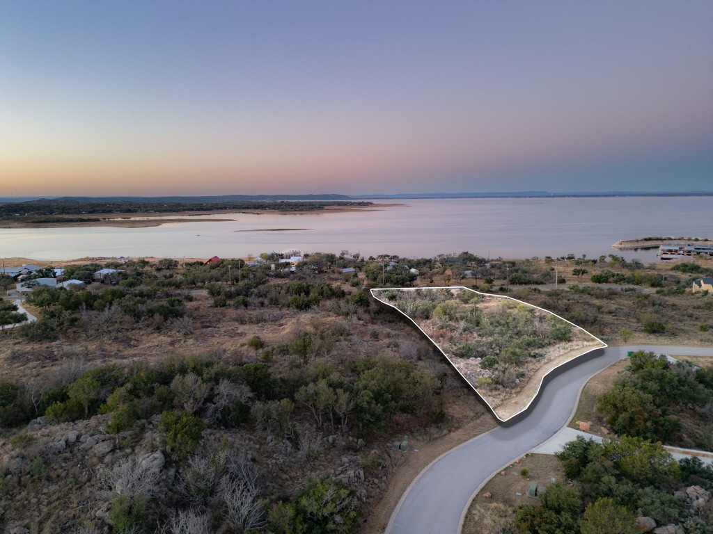 an aerial view of residential building and ocean