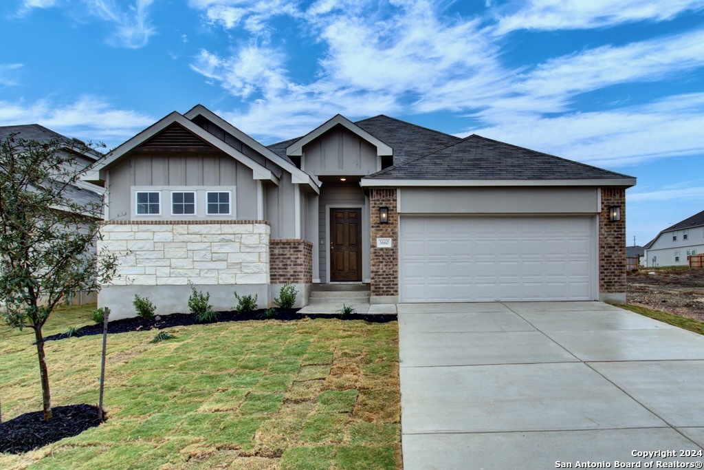 a front view of a house with garage