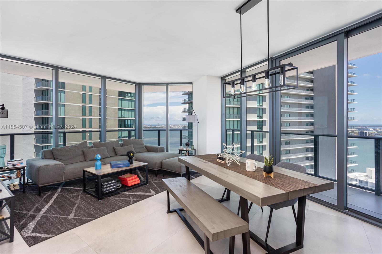 a living room with furniture a window and a table