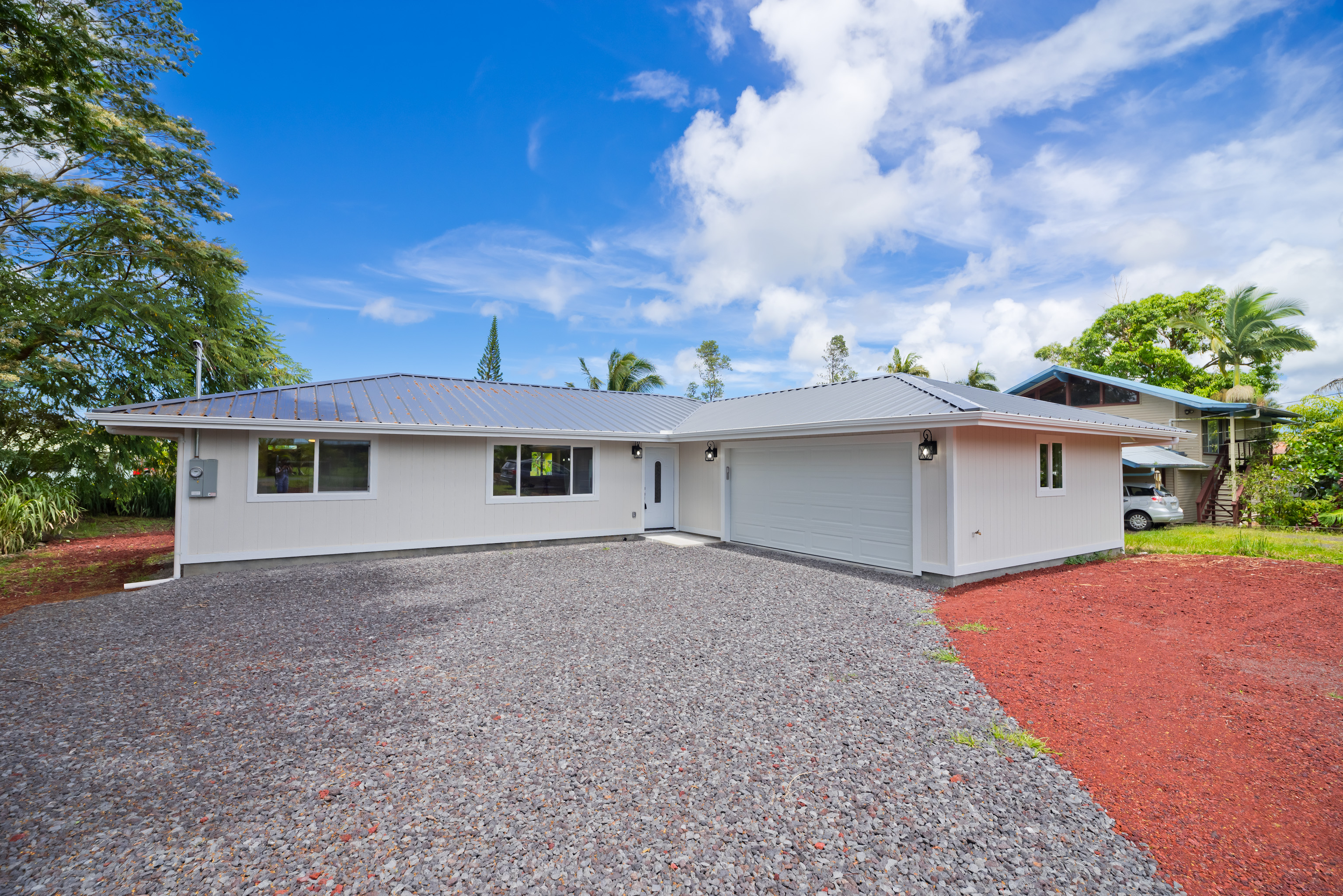 front view of a house with a yard