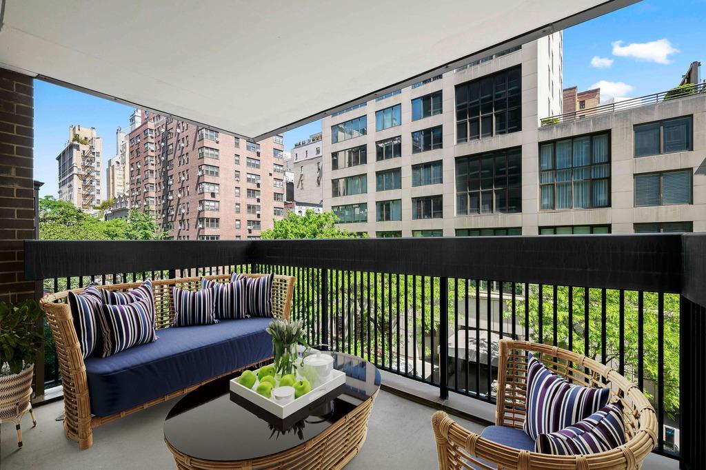 a view of a balcony with furniture